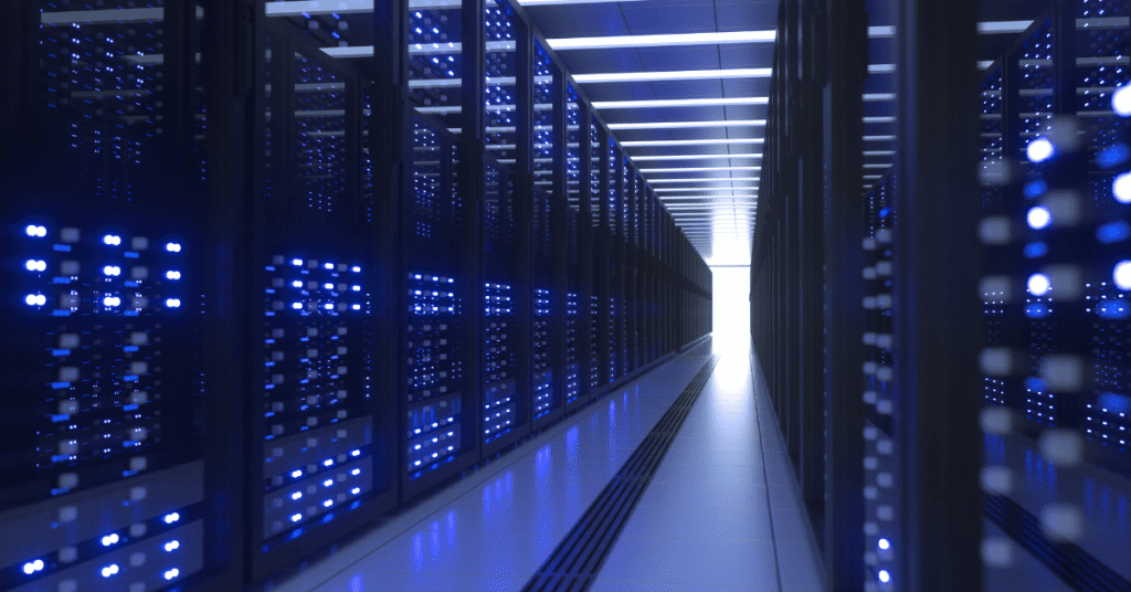 Long corridor of server racks in a data center illuminated by blue lights, symbolizing modern network infrastructure.