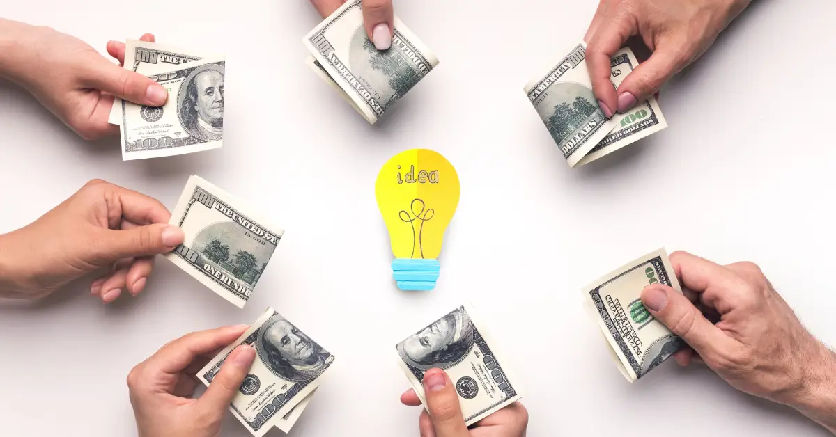 Multiple hands exchanging dollar bills around a central idea bulb, symbolizing crowdfunding.