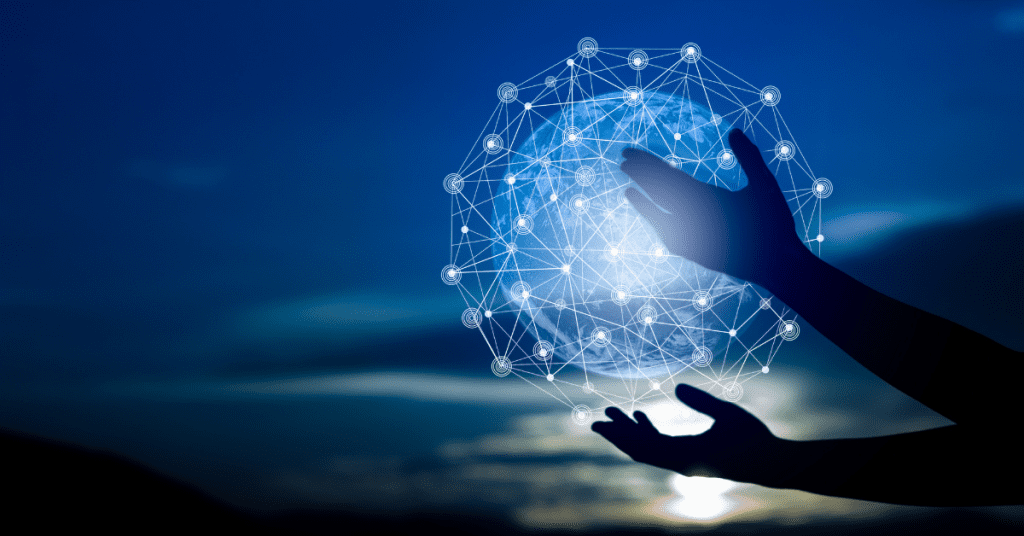 Silhouetted hands interacting with a glowing digital network globe against a twilight sky.